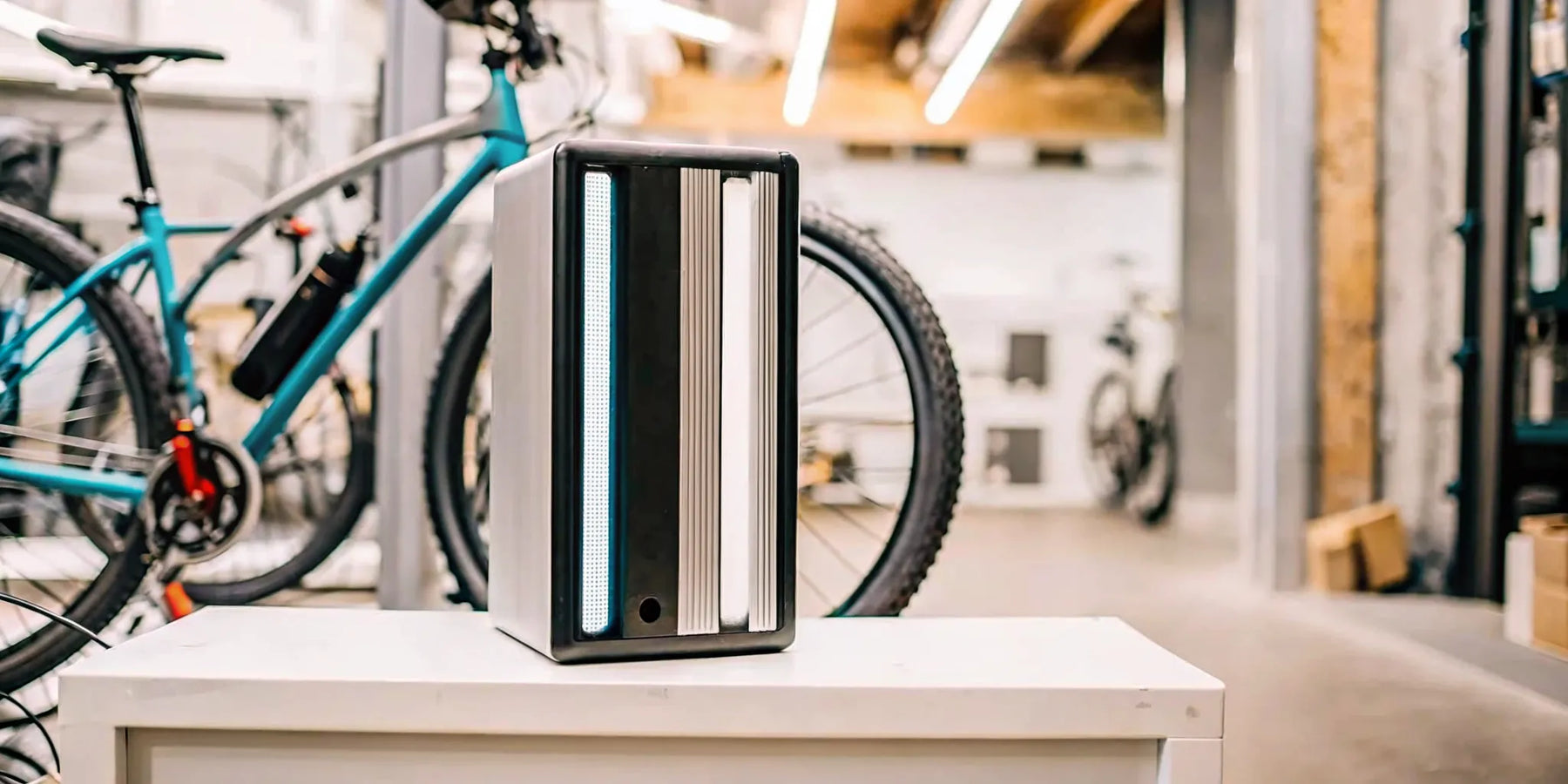 A 48v electric bike battery on a shelf with its price tag visible.