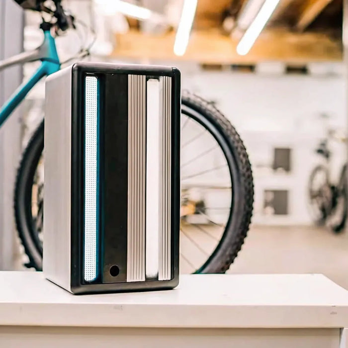 A 48v electric bike battery on a shelf with its price tag visible.