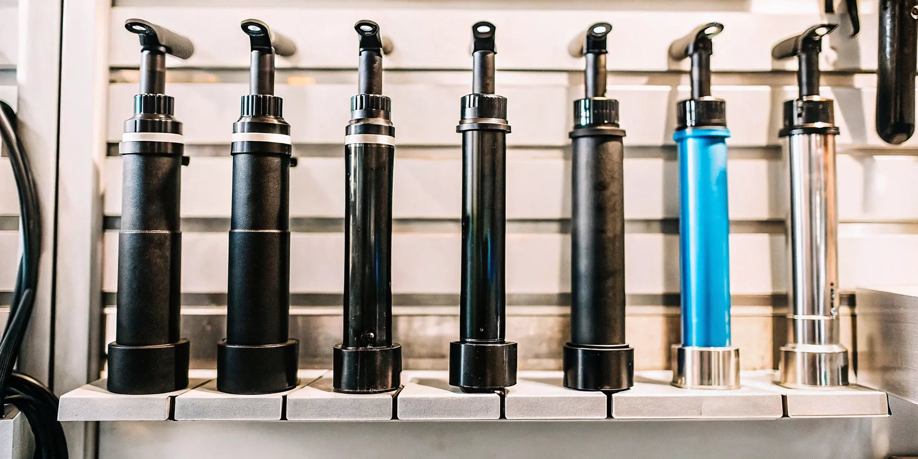 A variety of mini electric bike pumps in different styles and colors.