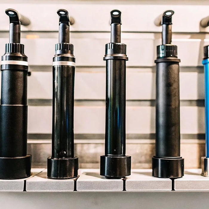 A variety of mini electric bike pumps in different styles and colors.