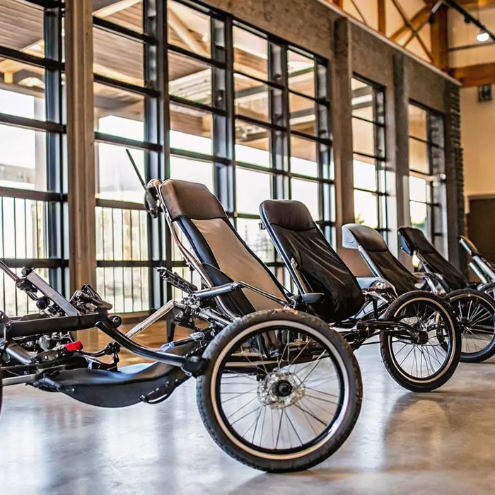 A row of recumbent e-bikes being compared for comfort in a product review.