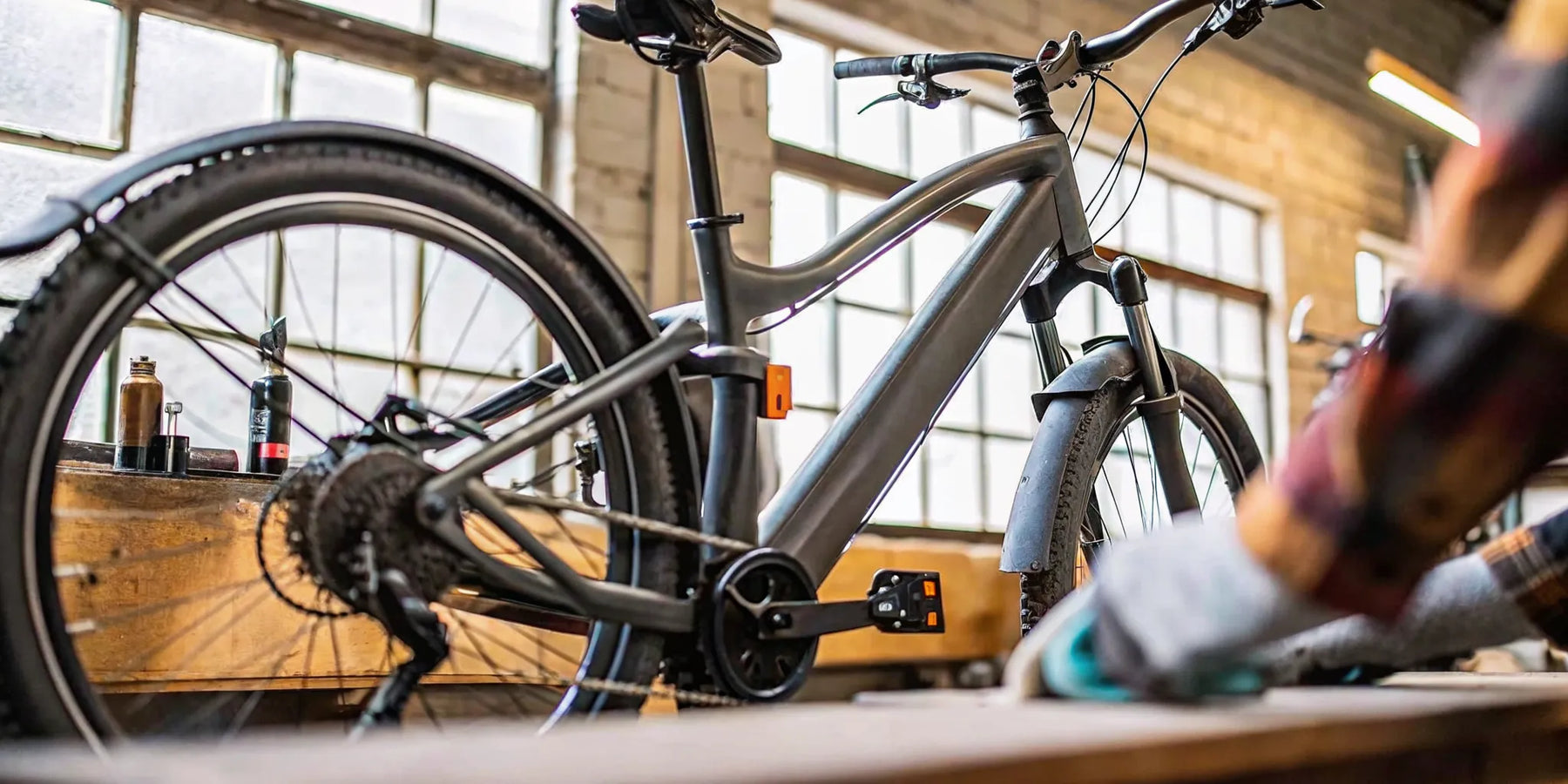 E-bike receiving routine maintenance and service in a workshop to keep it running reliably.