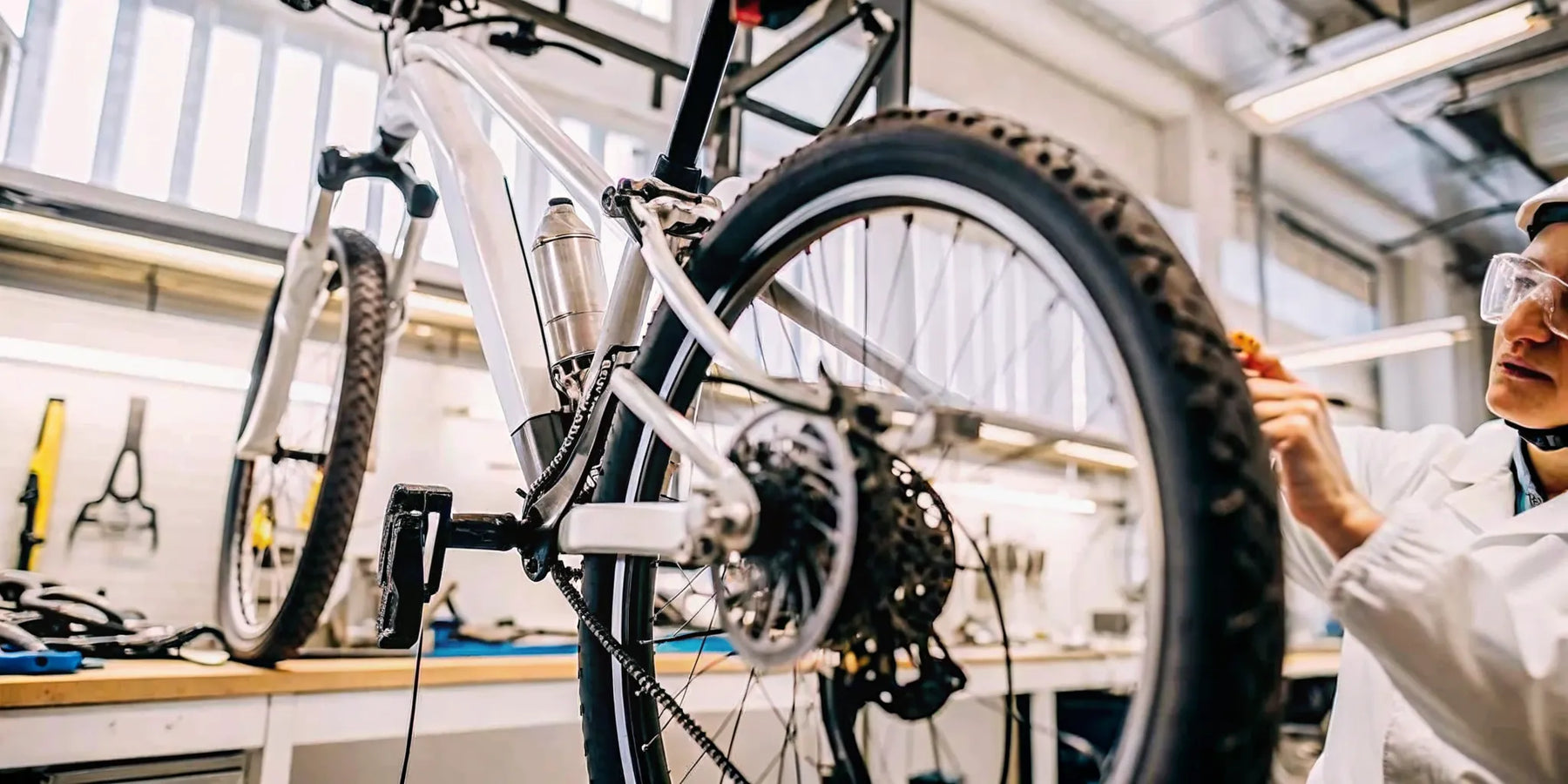 Technician inspecting an electric bike in a workshop
