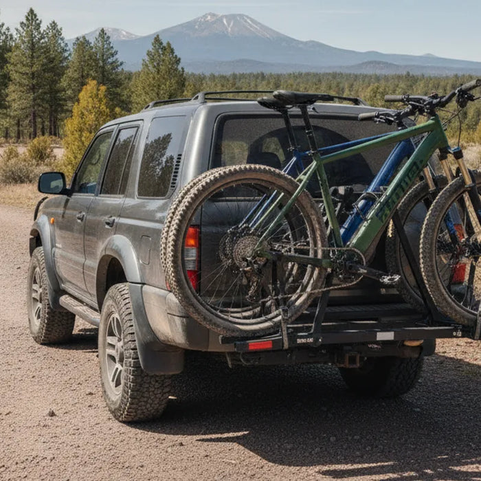 Electric bike mounted securely on a hitch rack behind an SUV