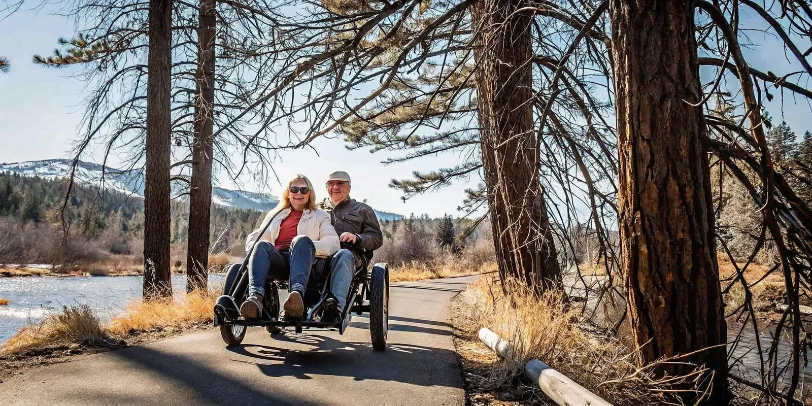 A couple riding an electric trike together on a paved trail near Bend, Oregon