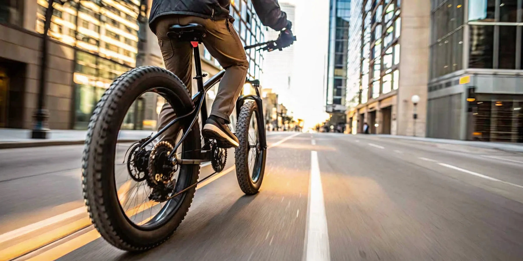 A person demonstrates how fast a fat tire ebike can go on a city street.
