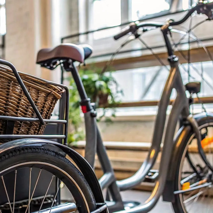 An adult electric tricycle with a cargo basket, available for sale from local dealers.