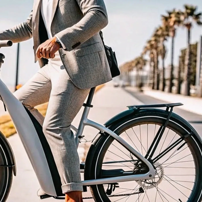 Man riding an ebike beach cruiser on a scenic path by the beach.