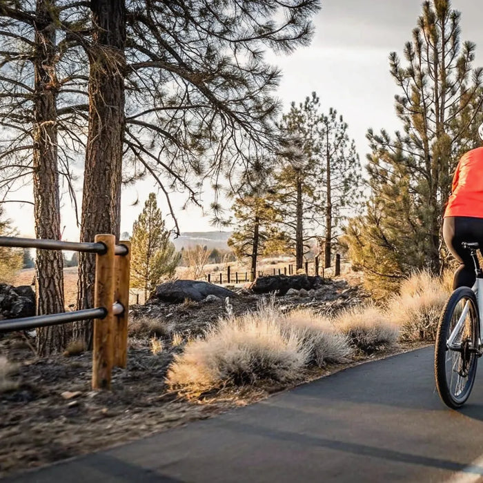 Rider gliding on a Segway torque-sensing electric bike on a scenic Bend Oregon path