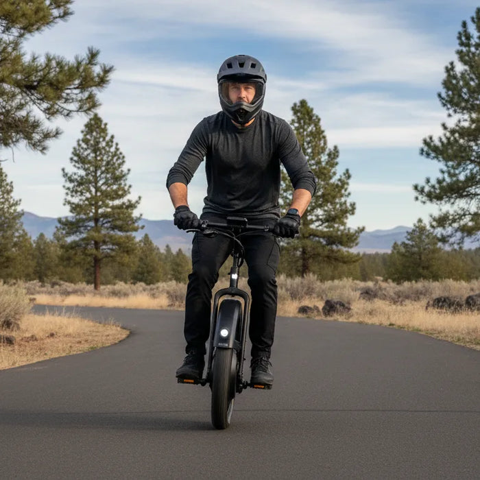 Rider learning to use a motorized unicycle in Central Oregon