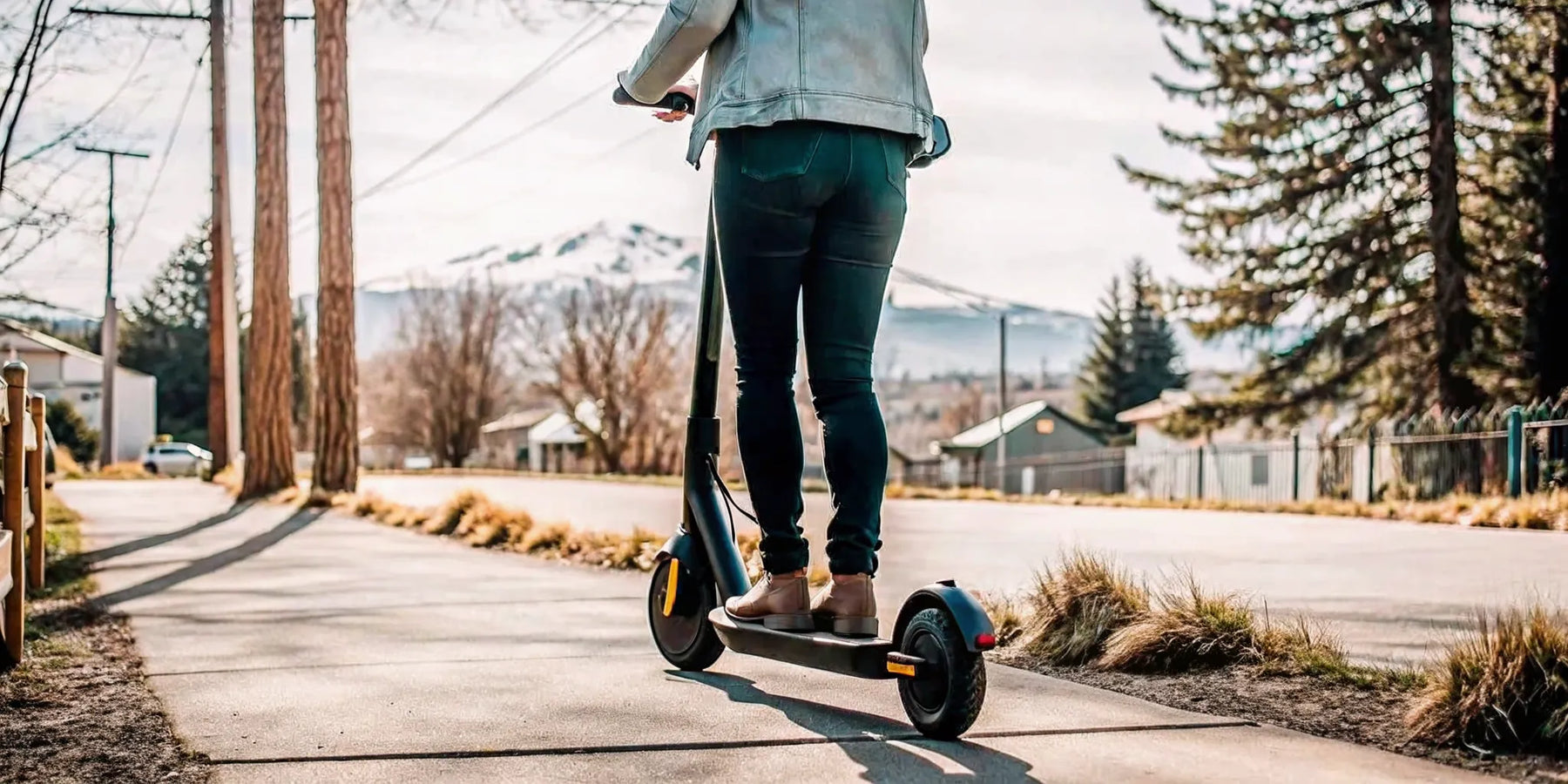 Segway E3 Pro electric scooter riding on a scenic trail in Bend Oregon with Cascade mountains in background