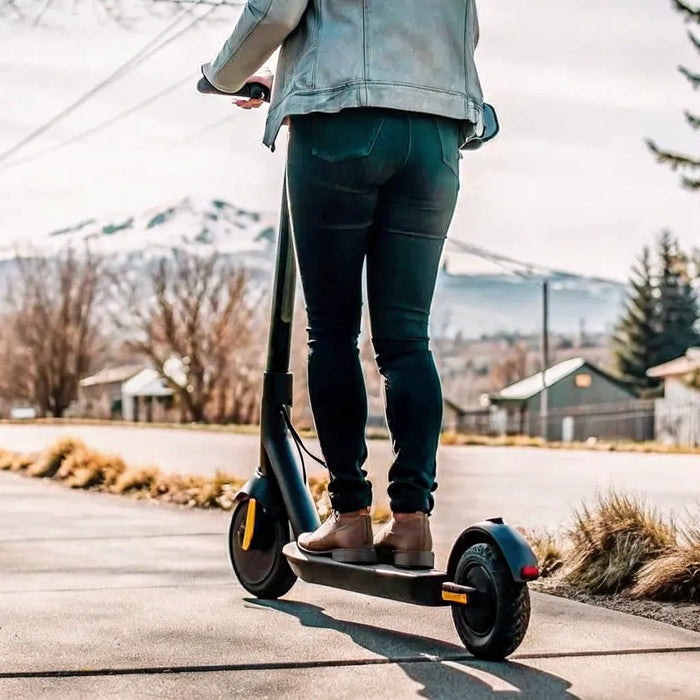 Segway E3 Pro electric scooter riding on a scenic trail in Bend Oregon with Cascade mountains in background