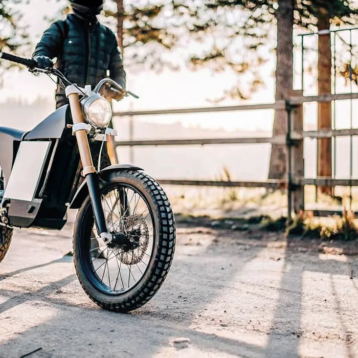 The Segway Xaber 300 e moto on a dirt trail, designed for off-road trail riding.