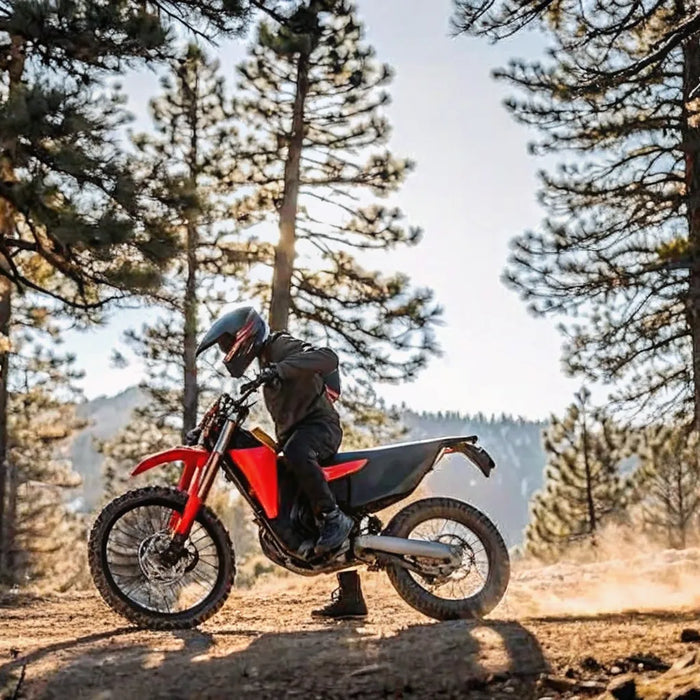 Segway Xaber 300 electric dirt bike in red and black on a Central Oregon trail