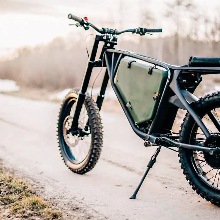 Segway Xaber 300 electric dirt bike for hunting parked on an off-road trail.