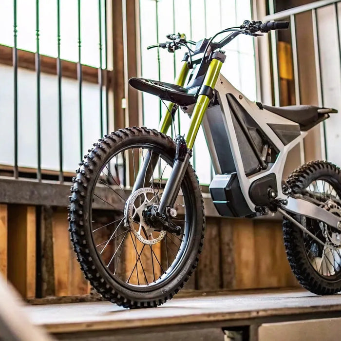 A Segway Xaber 300 electric dirt bike on a trail, ready for a real-world range test.