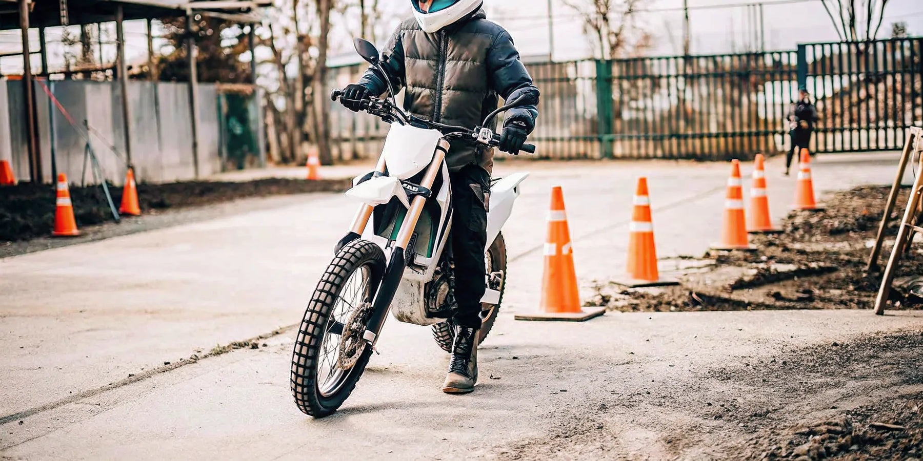 A beginner rides the Segway Xaber 300 electric dirt bike on a training course.