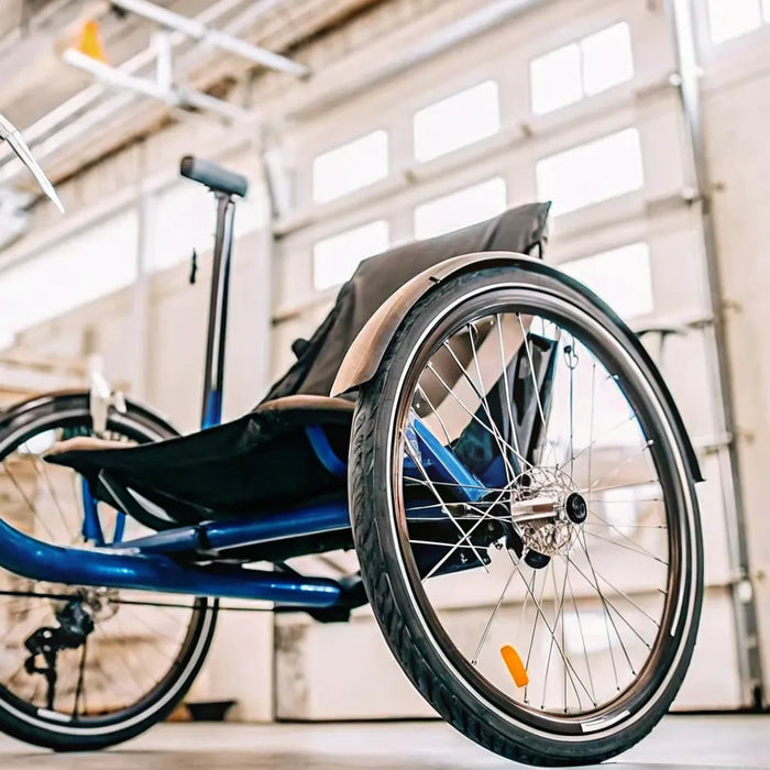 A stable semi recumbent electric trike with a supportive seat and pedal assist.