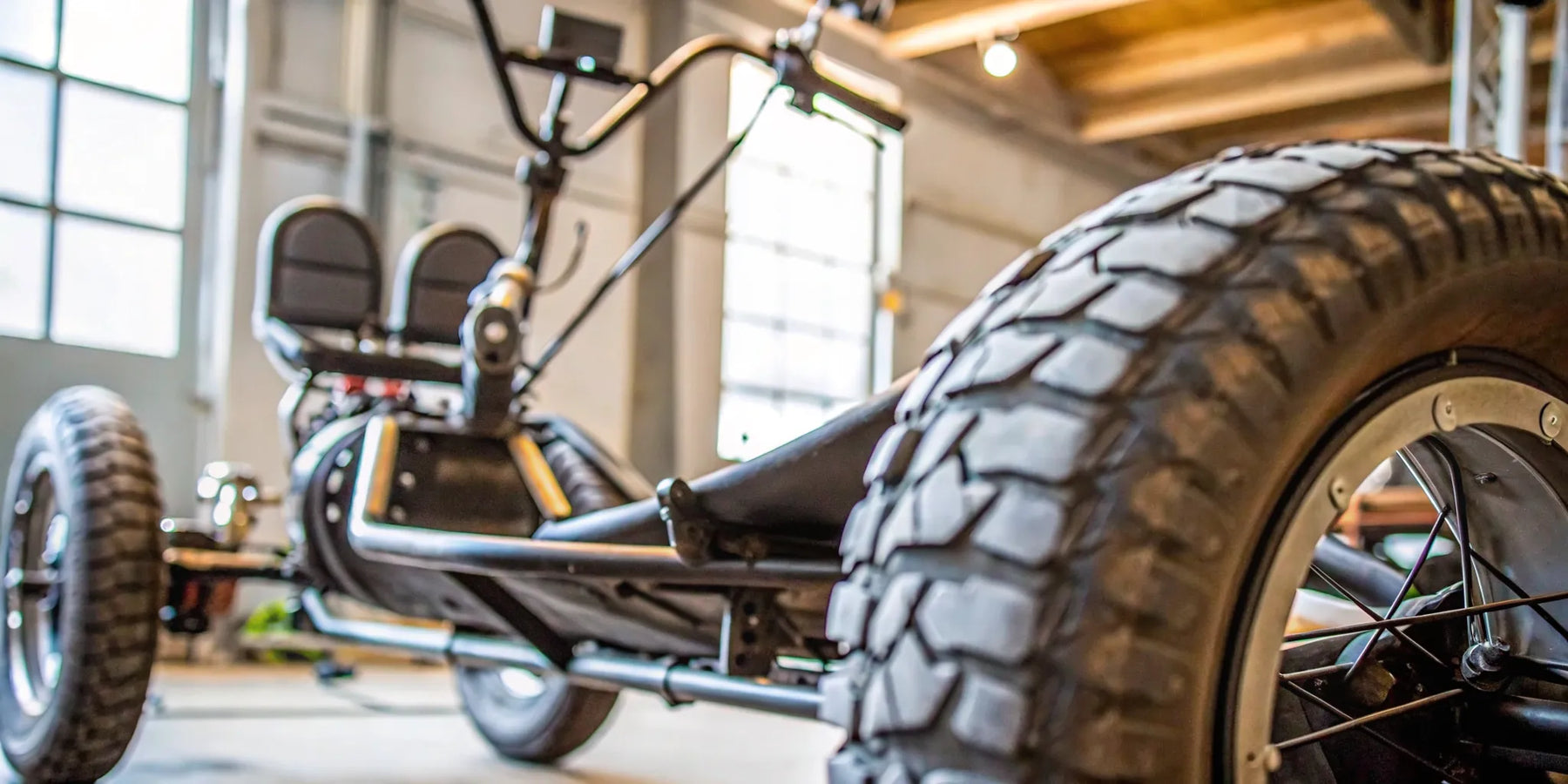 A stable fat tire electric trike with two seats, ready for any road.