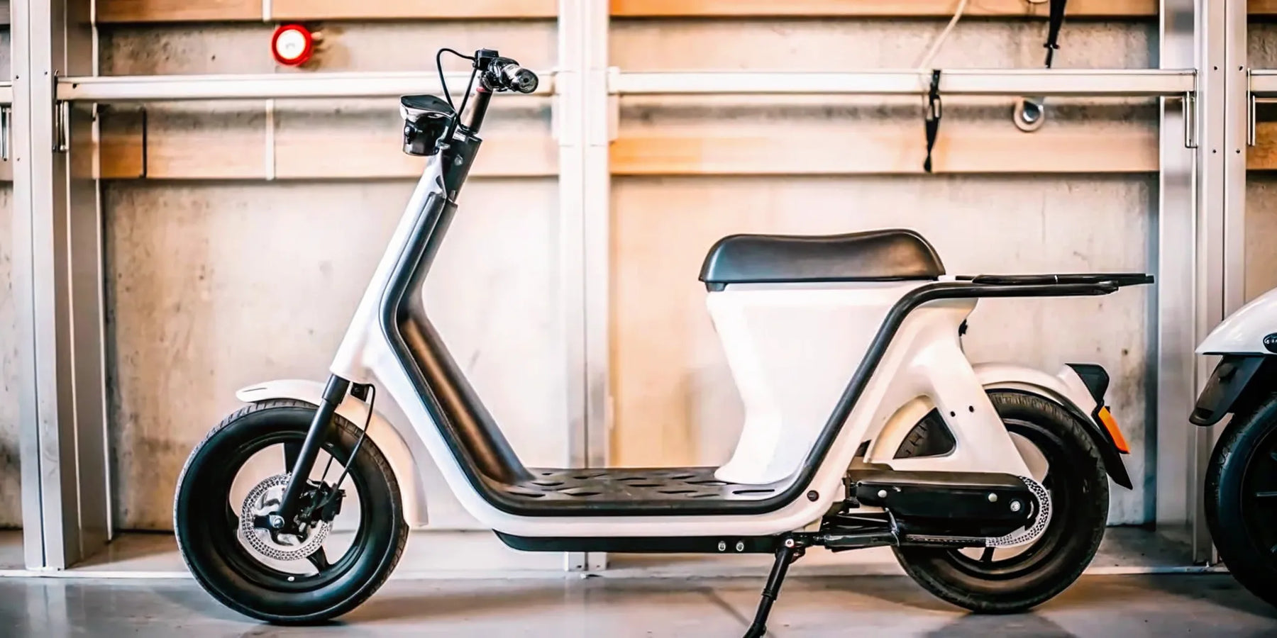 A modern commuter electric scooter parked on a city street.