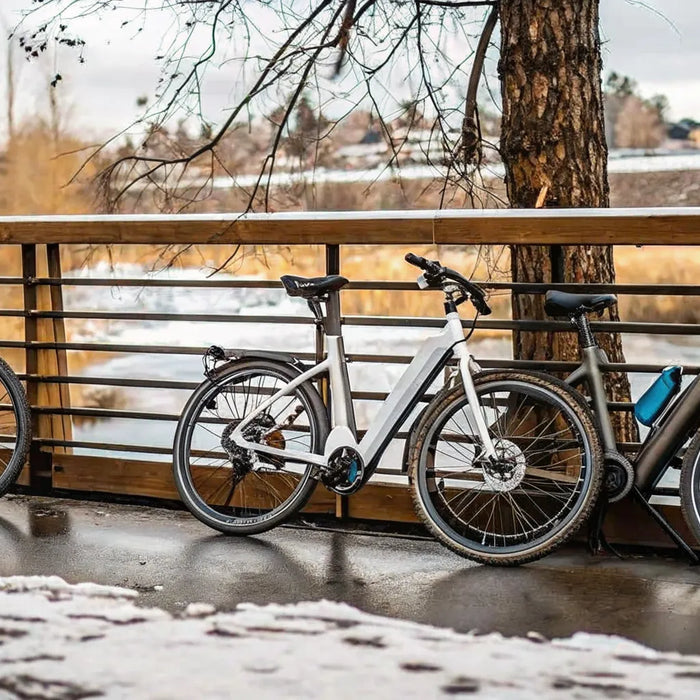 Three electric bikes on a snowy trail in Bend, Oregon.