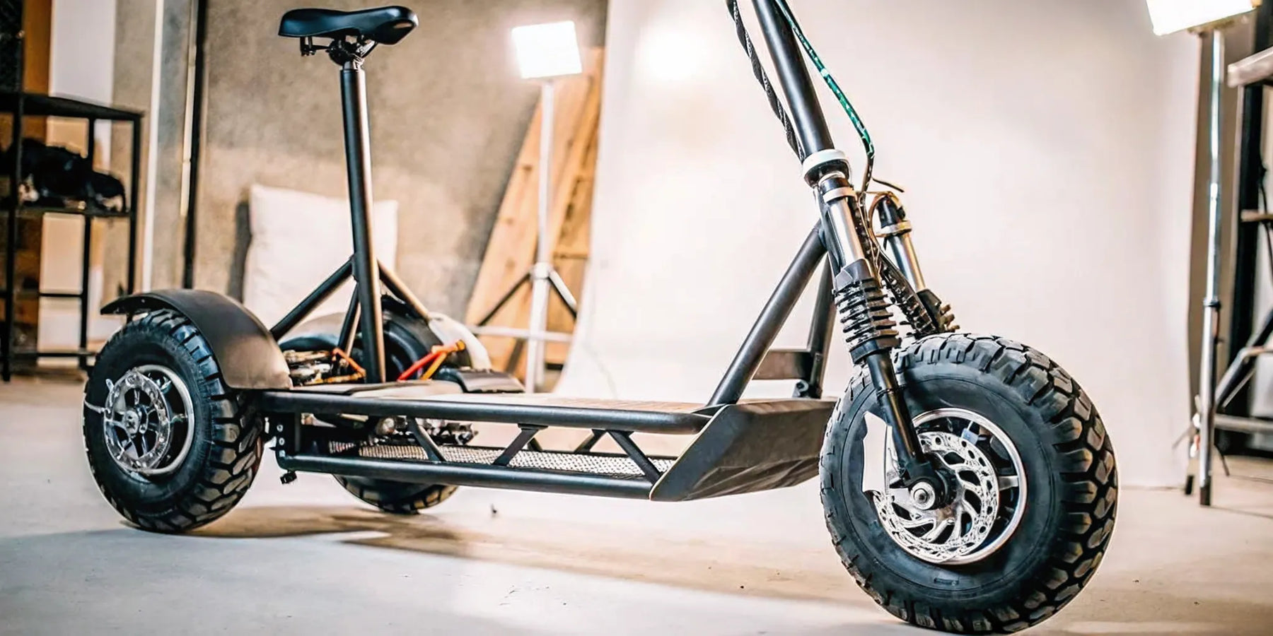 Adult electric scooter with a seat and a 50 mph top speed.