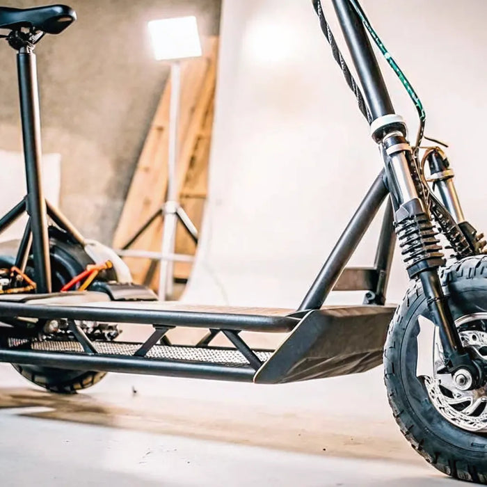 Adult electric scooter with a seat and a 50 mph top speed.