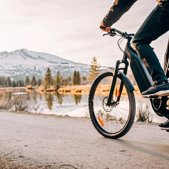 Rider pedaling a torque-sensing Segway electric bike along a Central Oregon river trail