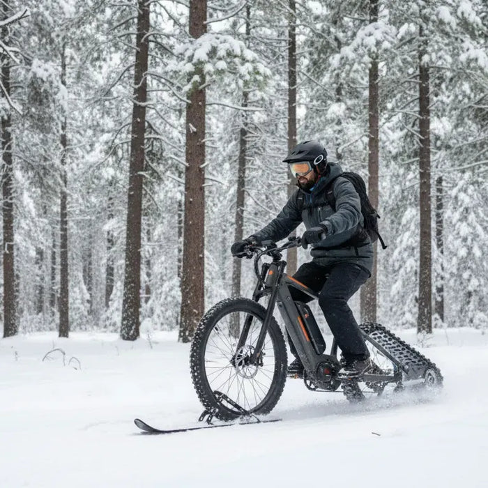 Electric snow bike riding through a snowy Central Oregon forest