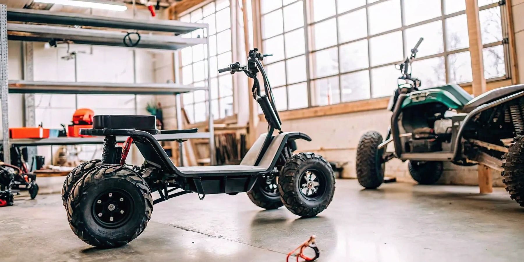A Segway Xaber 300 electric dirt bike being serviced in a repair shop in Oregon.